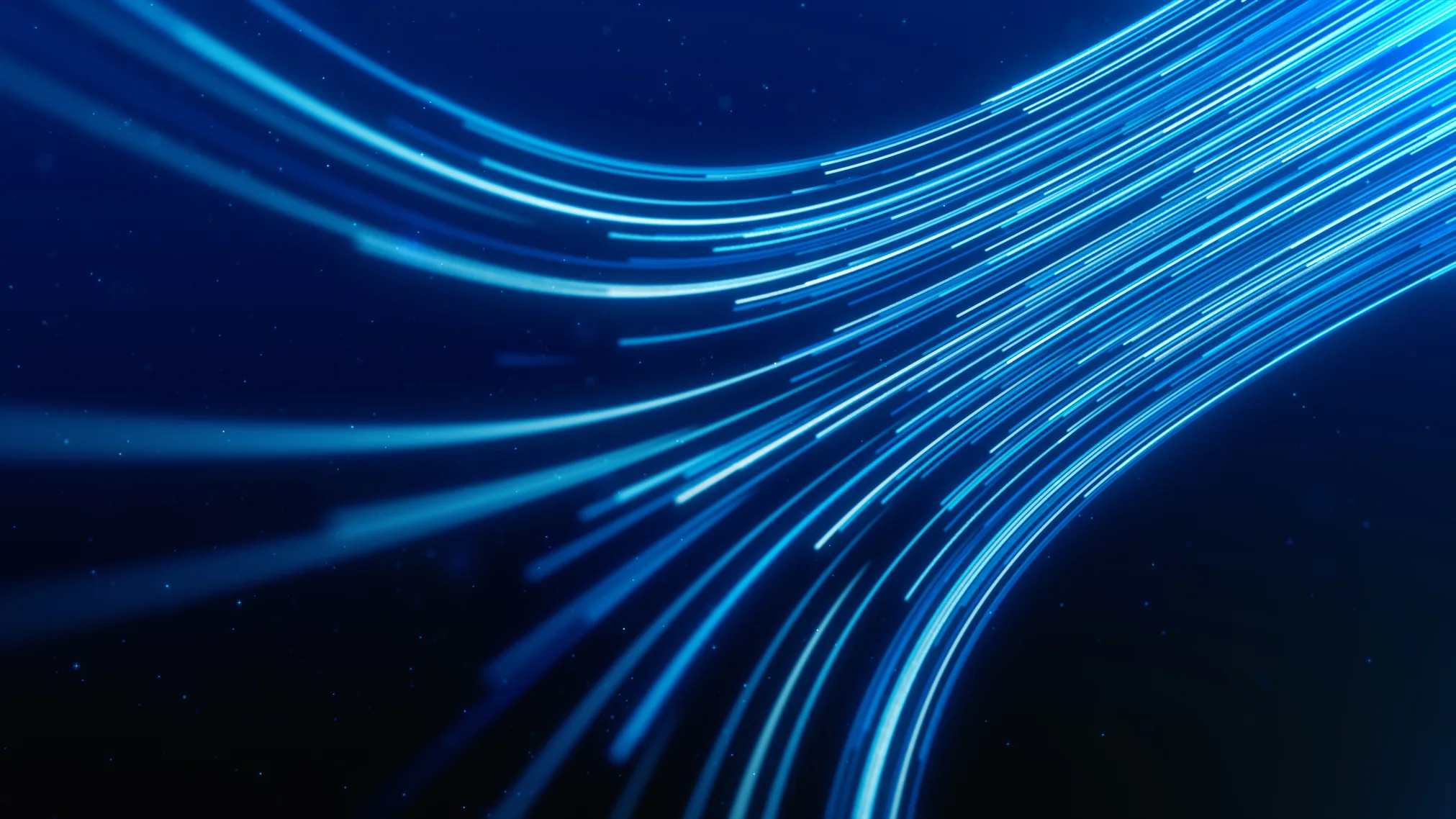 Streaks of blue light flowing through the dark