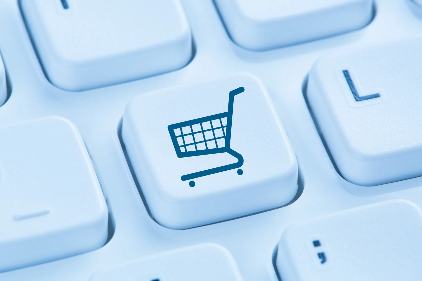 A keyboard key printed with a shopping-cart icon